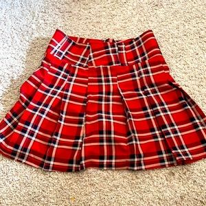 red pleated skirt